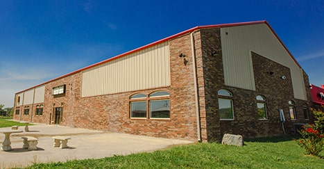 Metal Building with stacked stone veneer accents